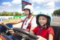 Father and daughter driving go kart Royalty Free Stock Photo