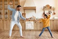 Father and daughter engaging in sword play Royalty Free Stock Photo