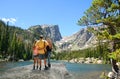 Father and daughter enjoying time together in mountains.