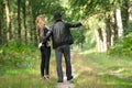 Father and daughter enjoying a walking in the forest Royalty Free Stock Photo