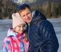 Father with daughter enjoying winter vacations Royalty Free Stock Photo