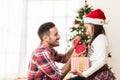 Father and daughter exchanging and opening Christmas presents Royalty Free Stock Photo