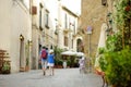 Father and daughter exploring the famous Orvieto, a medieval hill town, rising above the almost-vertical faces of tuff cliffs and