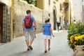 Father and daughter exploring the famous Orvieto, a medieval hill town, rising above the almost-vertical faces of tuff cliffs and