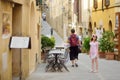 Father and daughter exploring in Montalcino town, located on top of a hill top and surrounded by vineyards, known worldwide for