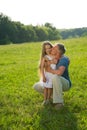 Father and daughter on a green meadow. Royalty Free Stock Photo