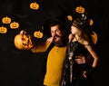 Father and daughter in Halloween costumes. Girl and bearded man