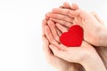 Father and daughter hands holding red heart isolated on white background, heart health insurance, family day Royalty Free Stock Photo