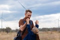 Father with daughter in hands standing on hill with nature lanscape. Little blonde girl smiling and hugging dad outdoor Royalty Free Stock Photo