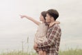 Father and daughter in happiness at the outside in the meadow.