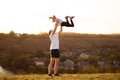 Father and daughter have fun together. Dad throws daughter up in sky. Royalty Free Stock Photo