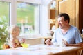 Father and daughter having breakfast