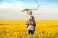 Father and daughter having fun, playing with kite together Royalty Free Stock Photo