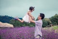 Father and daughter having fun to play together in the garden Royalty Free Stock Photo