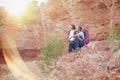 Father and daughter hiking climbing in mountains