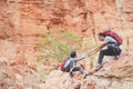 Father and daughter hiking climbing in mountains