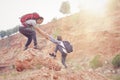 Father and daughter hiking climbing in mountains