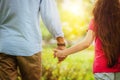 Father and daughter holding hands in the park. Royalty Free Stock Photo