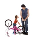 Father and daughter inflate wheel bike Royalty Free Stock Photo