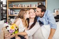 Father and daughter kissing mother Royalty Free Stock Photo