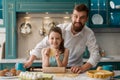 Father and daughter in kitchen