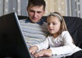 Father and daughter with laptop Royalty Free Stock Photo