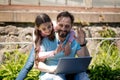 Father with daughter with laptop in park Royalty Free Stock Photo