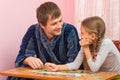 Father and daughter looked each other collecting puzzle elements Royalty Free Stock Photo