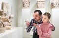 Father and daughter looking at ancient bas-reliefs in museum Royalty Free Stock Photo