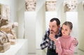 Father and daughter looking at ancient bas-reliefs in museum Royalty Free Stock Photo