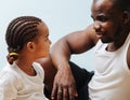 Father and daughter looking into each other`s eyes over blue Royalty Free Stock Photo