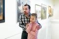 Father and daughter looking at expositions Royalty Free Stock Photo