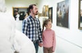 Father and daughter looking at expositions Royalty Free Stock Photo