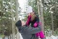 Father and daughter outdoor in the winter forest Royalty Free Stock Photo