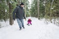 Father and daughter outdoor in the winter forest Royalty Free Stock Photo