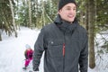 Father and daughter outdoor in the winter forest Royalty Free Stock Photo