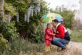 Father and daughter in the park under an umbrella Royalty Free Stock Photo