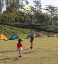 Father and daughter, People camped on the grass in the park, summer in guangzhou, China Royalty Free Stock Photo