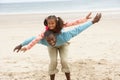 Father and daughter playing on beach Royalty Free Stock Photo