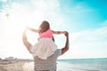 Father with daughter playing with kite and having fun on the beach - Dad enjoying time with his kid outdoor - Family relationship Royalty Free Stock Photo