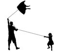 father and daughter playing with kite