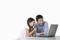 Father and daughter playing with laptop on kitchen counter Royalty Free Stock Photo