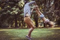 Father and daughter playing in meadow. Royalty Free Stock Photo