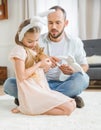 Father and daughter playing with rabbit Royalty Free Stock Photo
