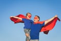 Father and daughter playing superhero at the day time. Royalty Free Stock Photo