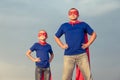 Father and daughter playing superhero at the day time. Royalty Free Stock Photo