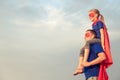 Father and daughter playing superhero at the day time. Royalty Free Stock Photo