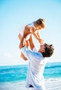 Father and daughter playing together at the beach Royalty Free Stock Photo