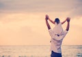 Father and Daughter Playing Together at the Beach at Sunset Royalty Free Stock Photo