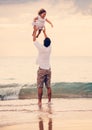 Father and Daughter Playing Together at the Beach at Sunset Royalty Free Stock Photo